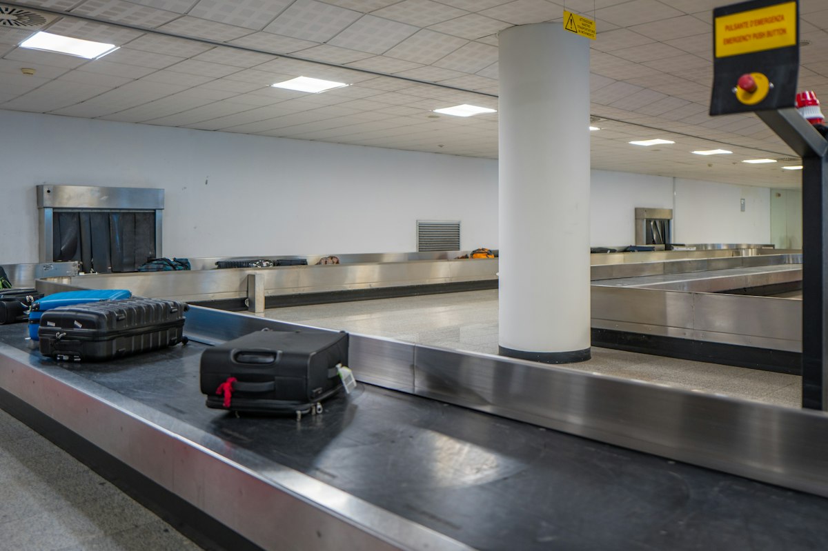 Suitcase on an airport baggage claim carousel