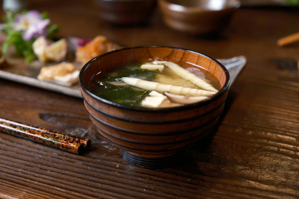 Japanese meal served in bowls on a wooden table