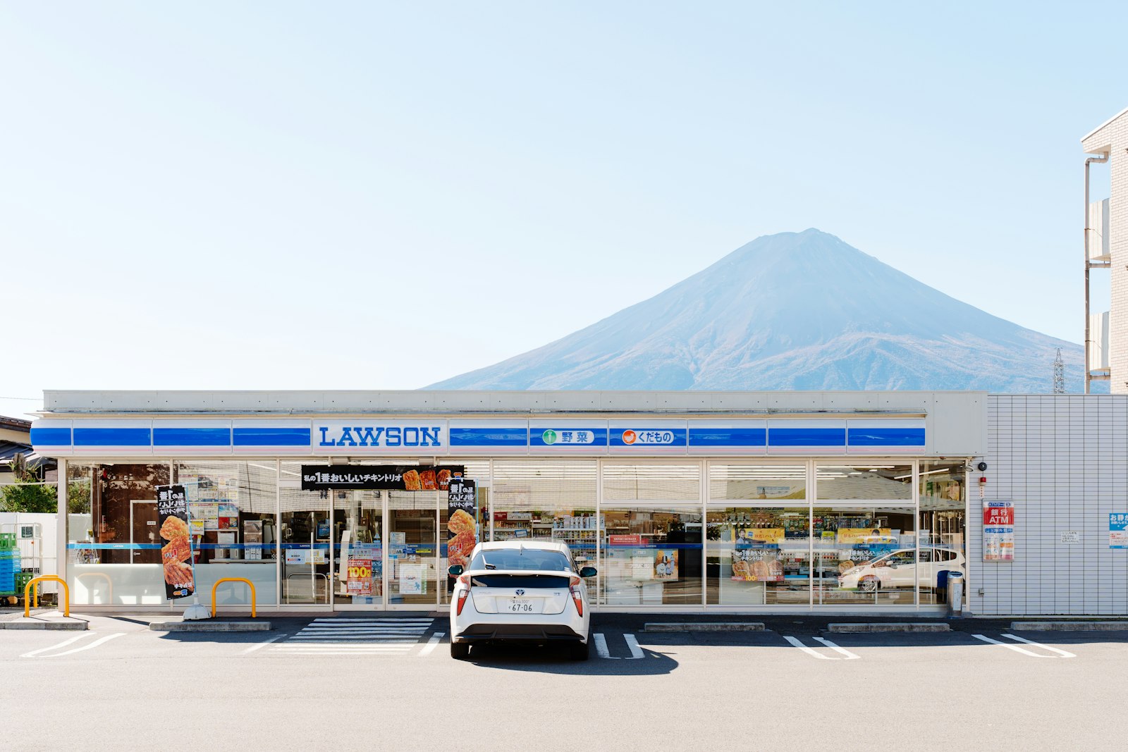 Lawson convenience store with Mount Fuji behind it