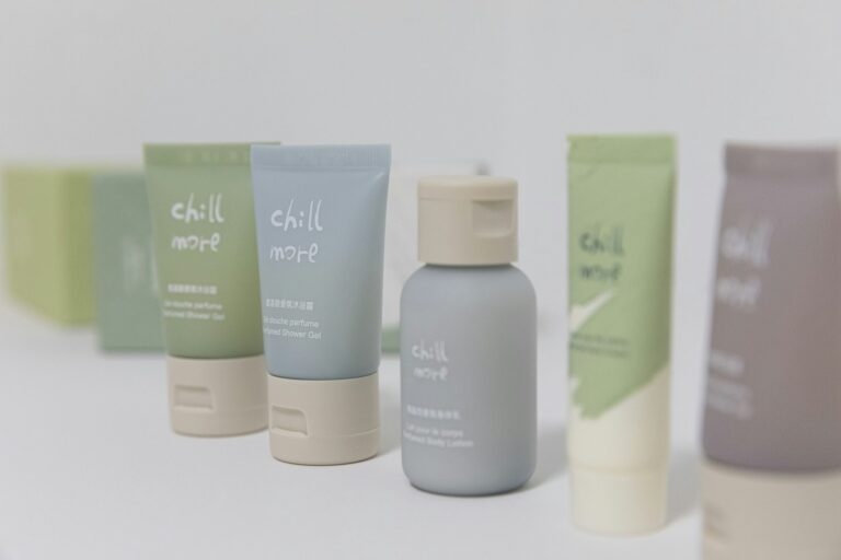Row of travel-size toiletry bottles and tubes