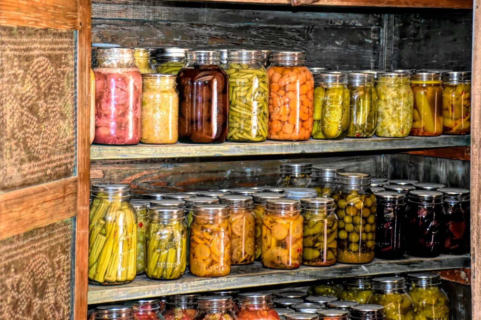 Wooden shelves filled with jars for organized food storage