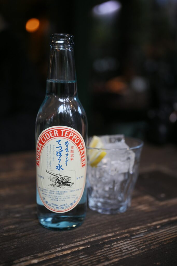 A bottle of Arima Cider Teppo-sui, the local soda of Arima Onsen, served with a glass of ice