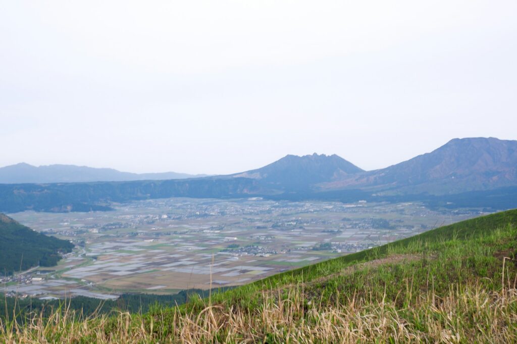 Panoramic view over the farms of the Aso Caldera toward the central peaks from Daikanbo