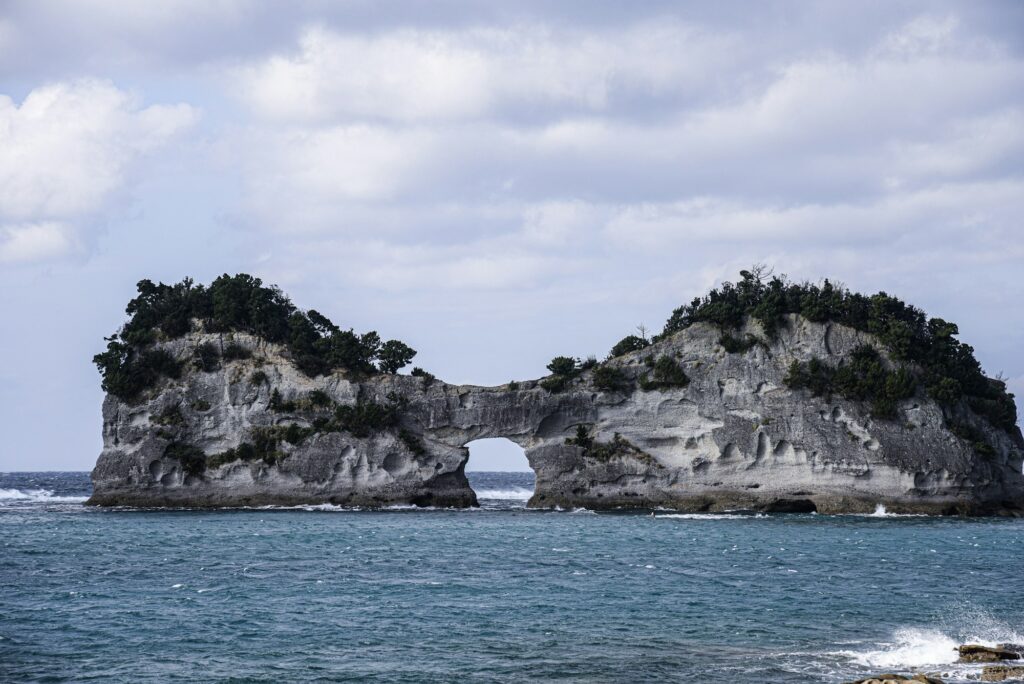 Engetsu Island, a rocky islet with a natural arch through its center, off the coast of Shirahama