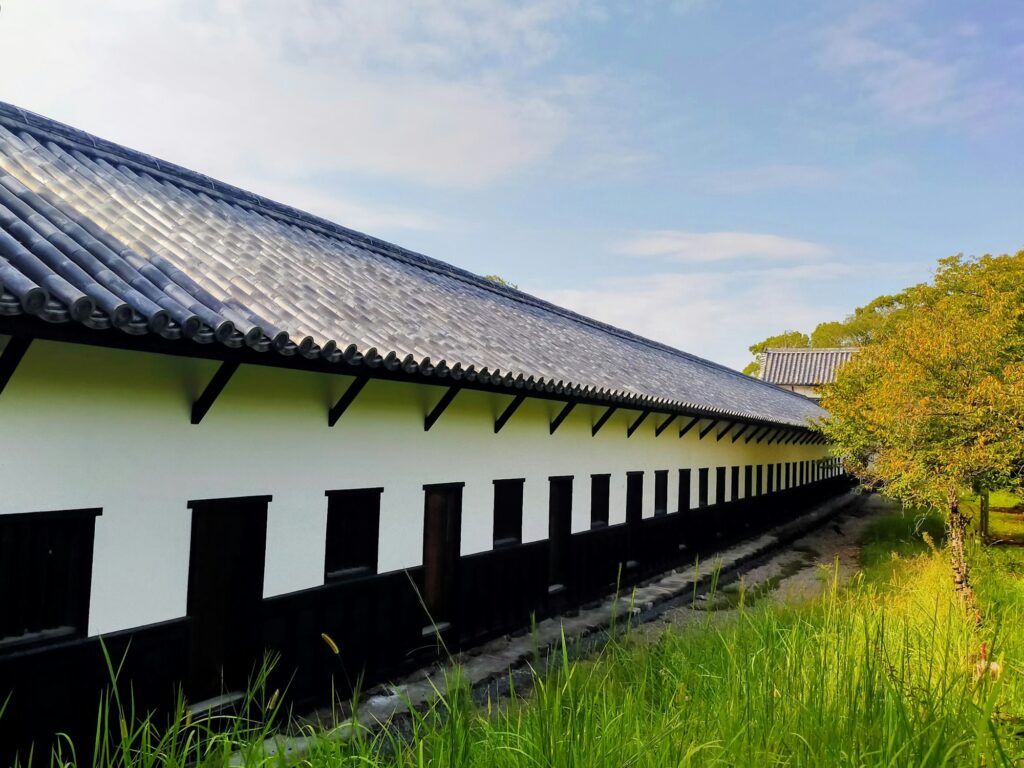 Long white-walled turret on the grounds of the Fukuoka Castle ruins