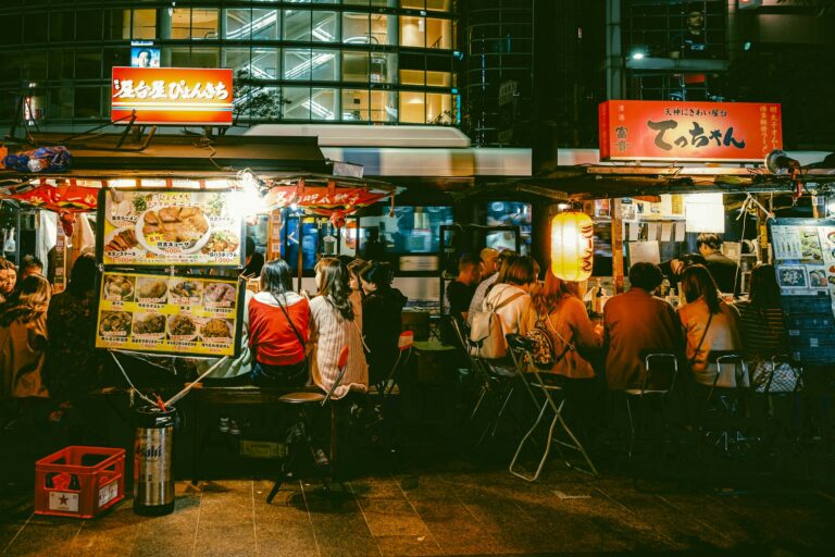 Diners crowding yatai food stalls at night in Tenjin, Fukuoka