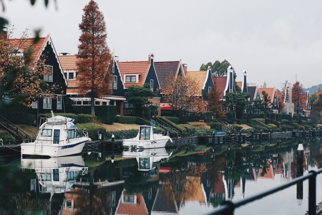 Dutch-style houses and boats along a canal at Huis Ten Bosch