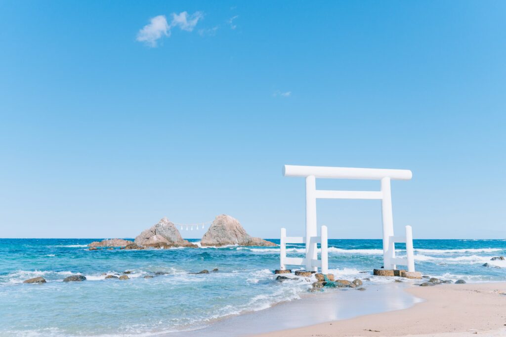 The white torii gate and the twin wedded rocks at Sakurai Futamigaura in Itoshima