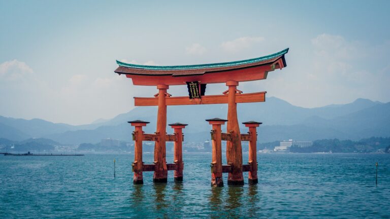 The vermilion floating torii gate of Itsukushima Shrine standing in the sea off Miyajima