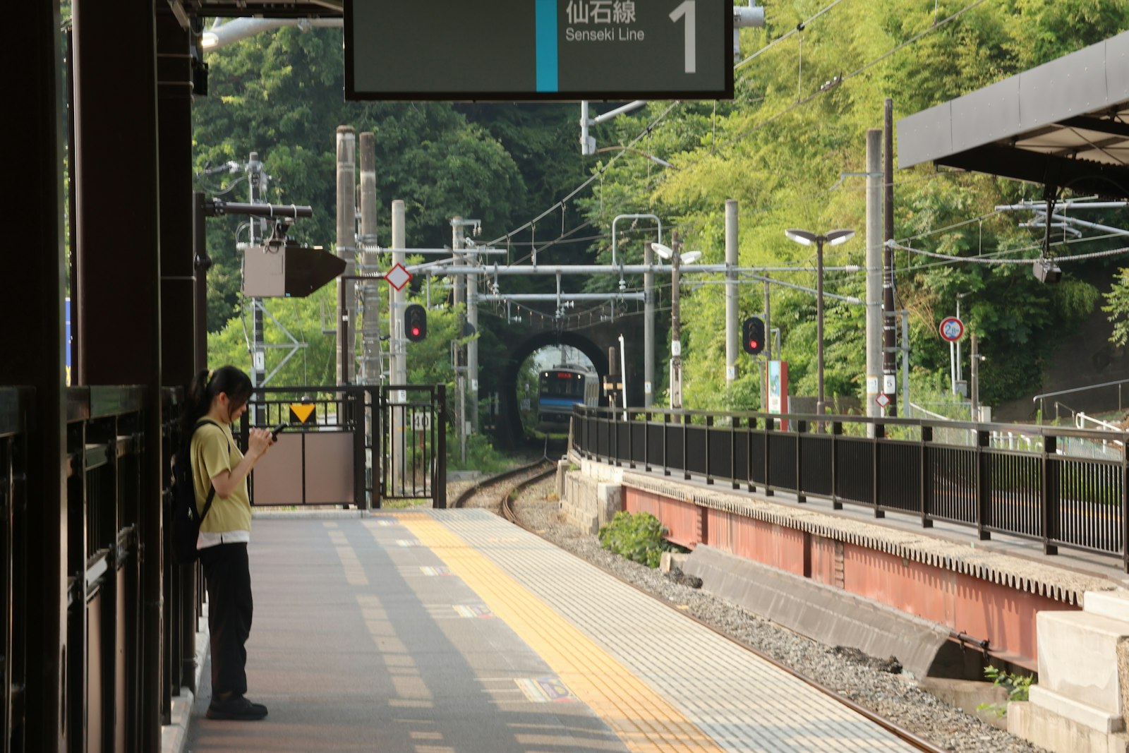 Traveler on a quiet train platform in Japan