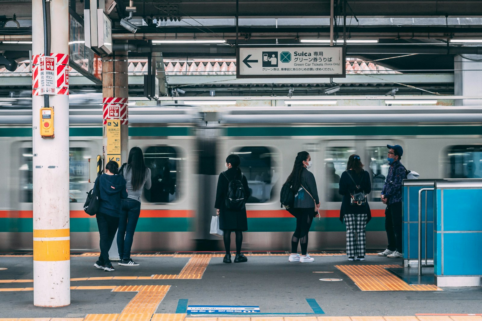 JR commuter train at a busy Tokyo platform