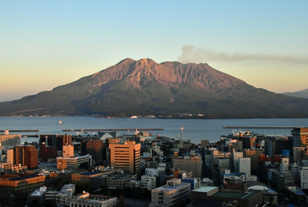 View over central Kagoshima to Sakurajima across the bay at dusk