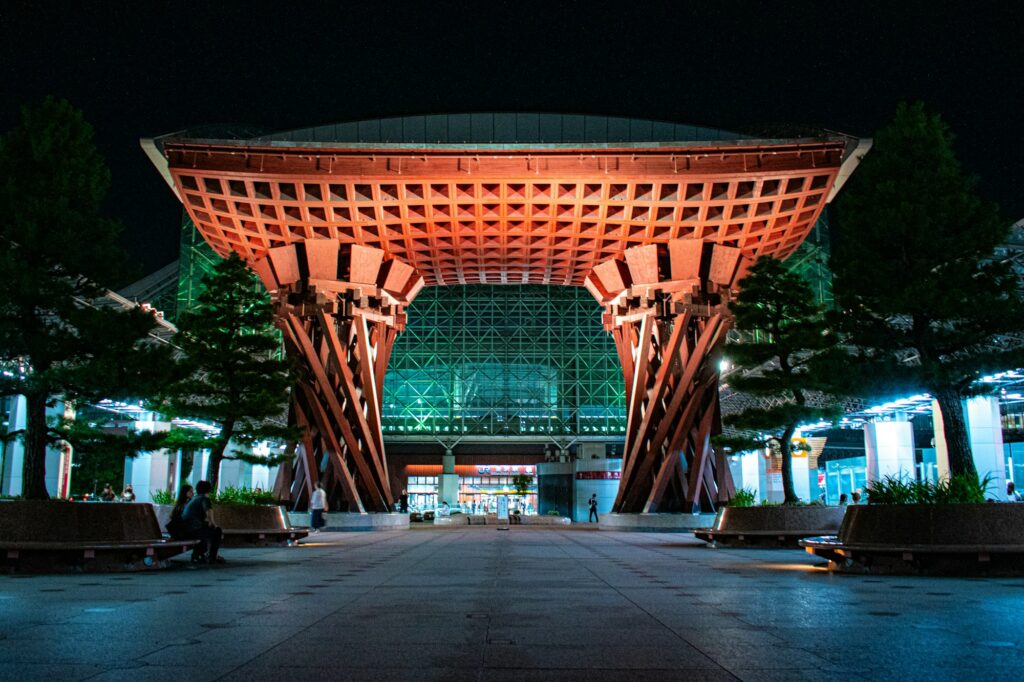 The wooden Tsuzumi-mon gate at Kanazawa Station lit up at night