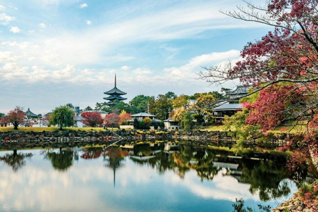 The Five-Story Pagoda of Kofuku-ji reflected in Sarusawa Pond with autumn leaves in Nara