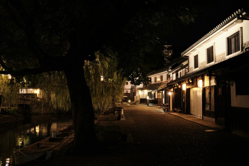 The Kurashiki canal and white-walled storehouses lit up at night