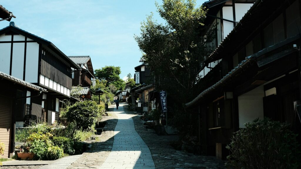 Old wooden houses along the stone-paved Nakasendo street in Magome-juku