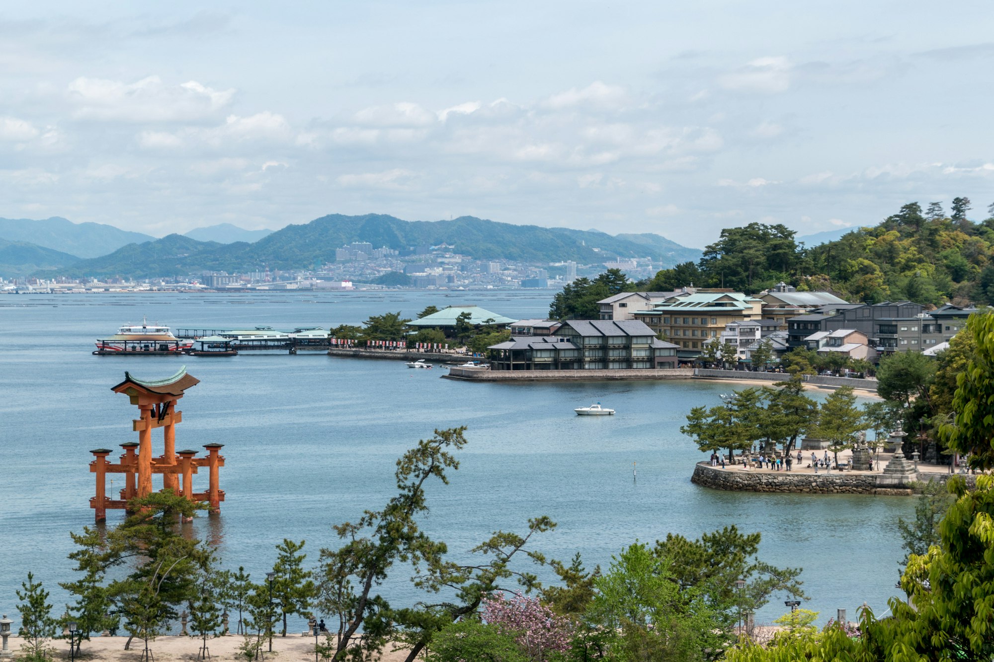View over Miyajima town and the floating torii with the mainland across the water