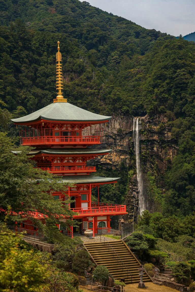 The three-story pagoda of Seigantoji Temple with Nachi Falls behind it