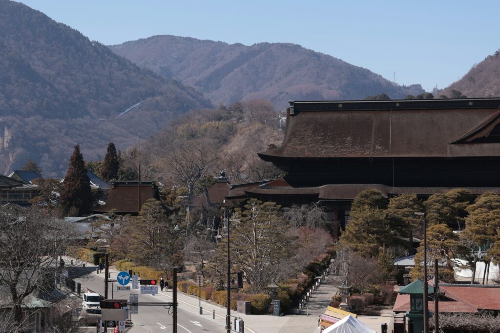 Zenko-ji temple buildings with the mountains around Nagano City