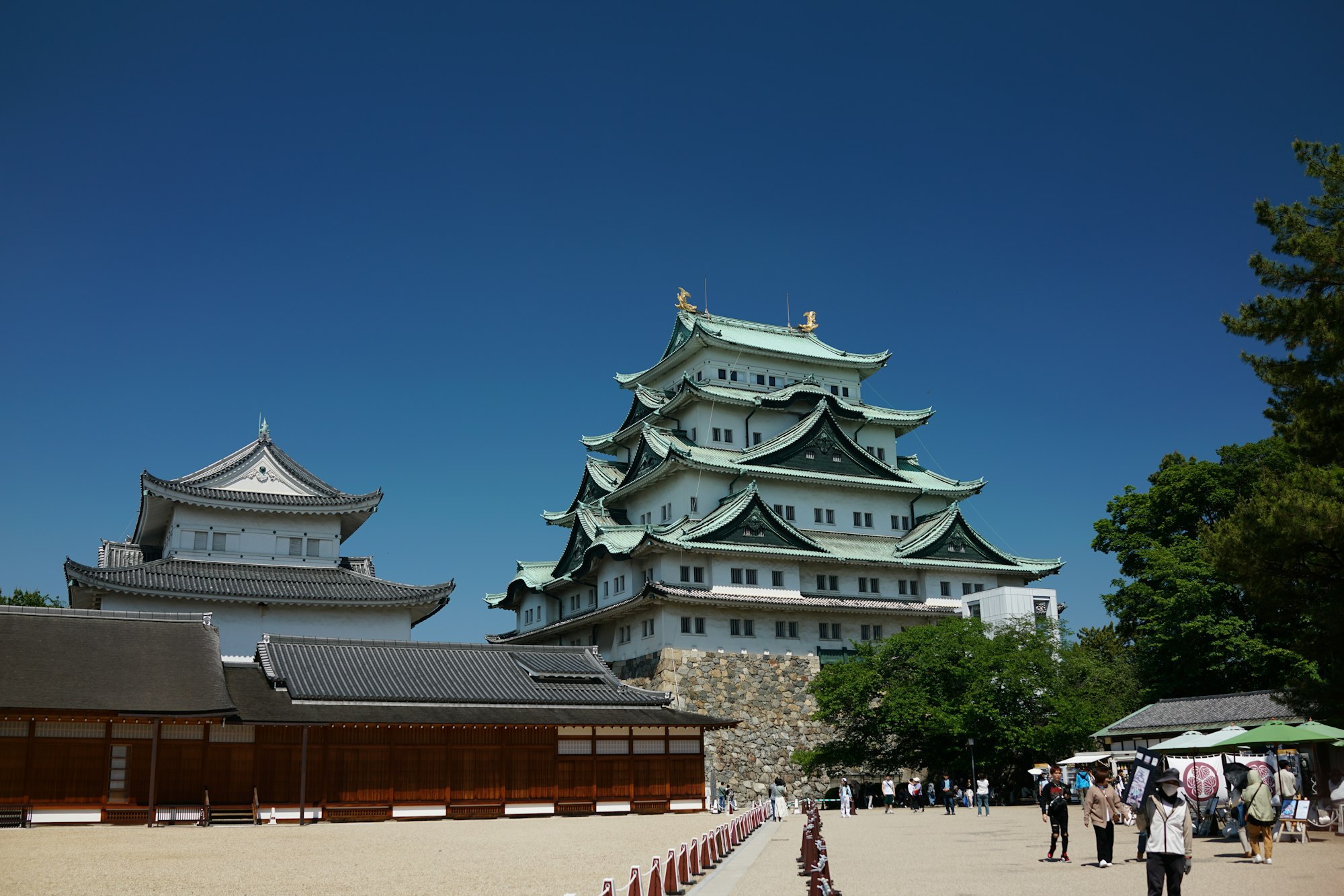 Nagoya Castle main keep with its green roofs and golden shachi above the Honmaru Palace