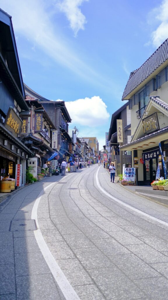 The sloping Omotesando street in Narita lined with traditional wooden shop buildings