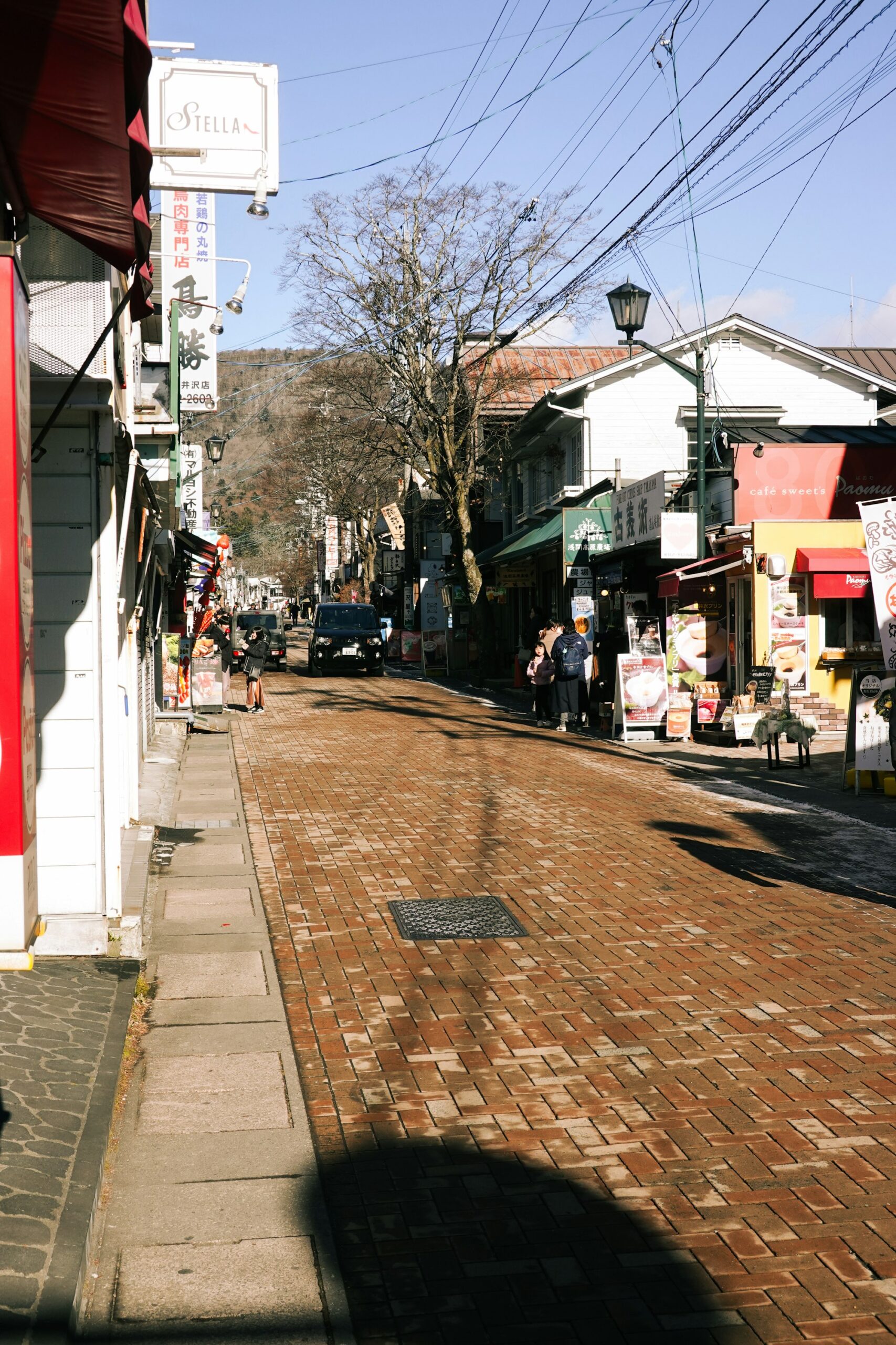 Shops along a brick-paved street in Old Karuizawa