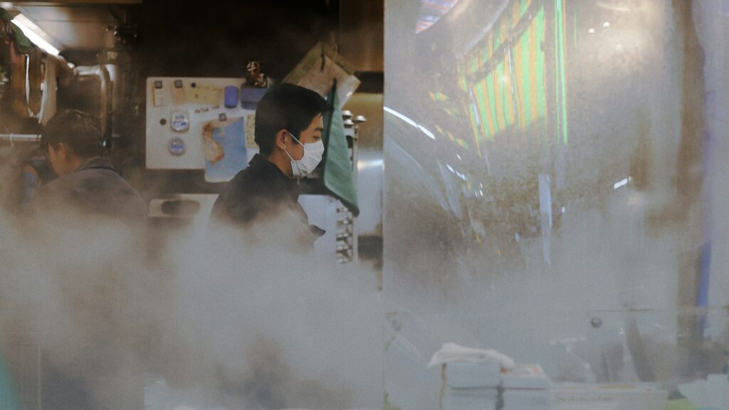 Steam rising from a food stall inside Omicho Market in Kanazawa