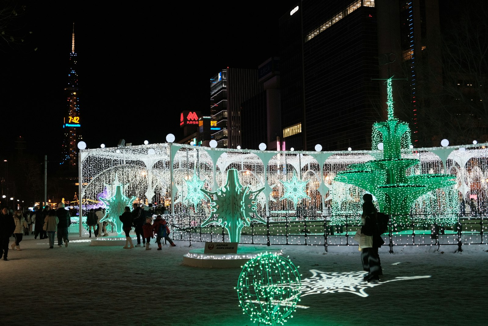 Odori Park in Sapporo lit up on a winter night, with the Sapporo TV Tower behind