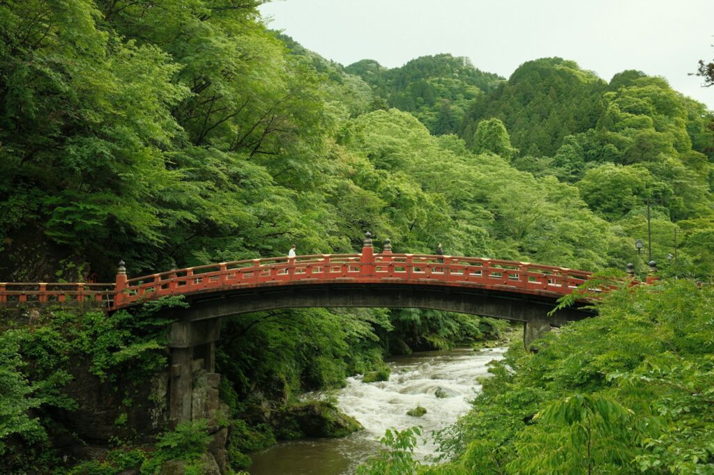 The red lacquered Shinkyo Bridge over the Daiya River in Nikko