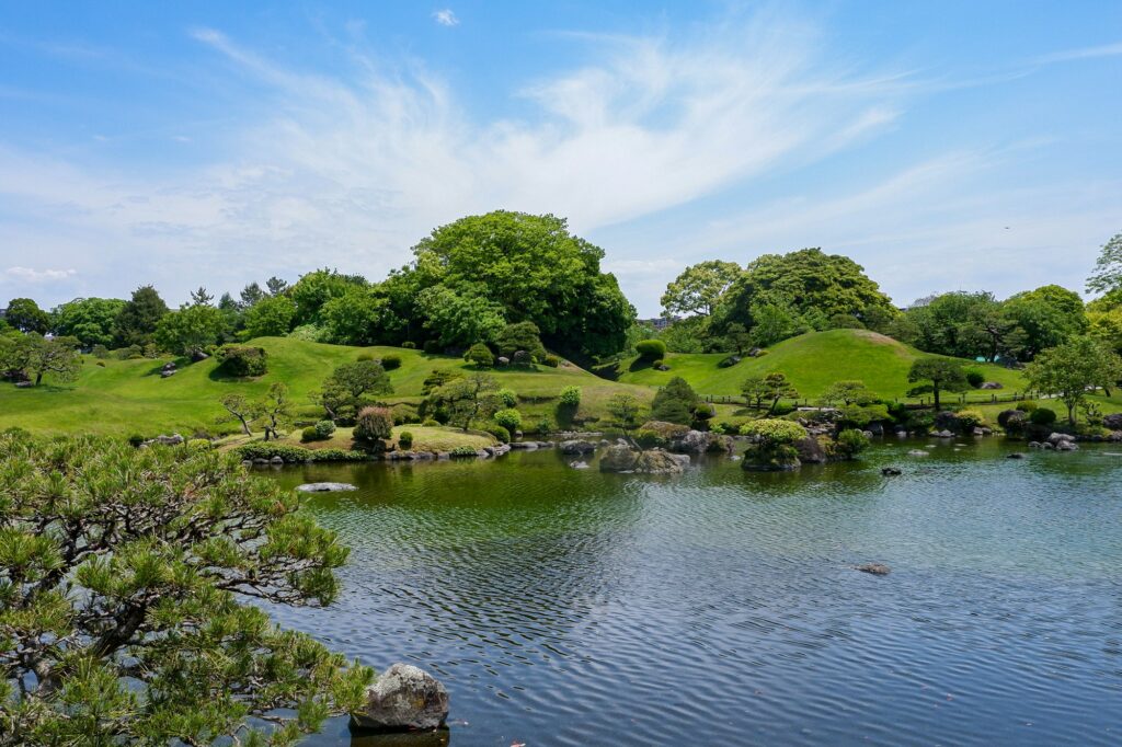 The spring-fed pond and pine trees of Suizenji Jojuen Garden in Kumamoto