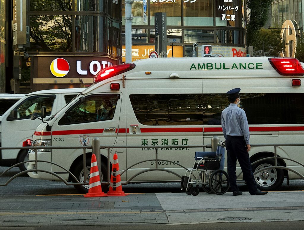 An ambulance crew in Ginza. Medical care in Japan is efficient, but visitors pay the full cost.