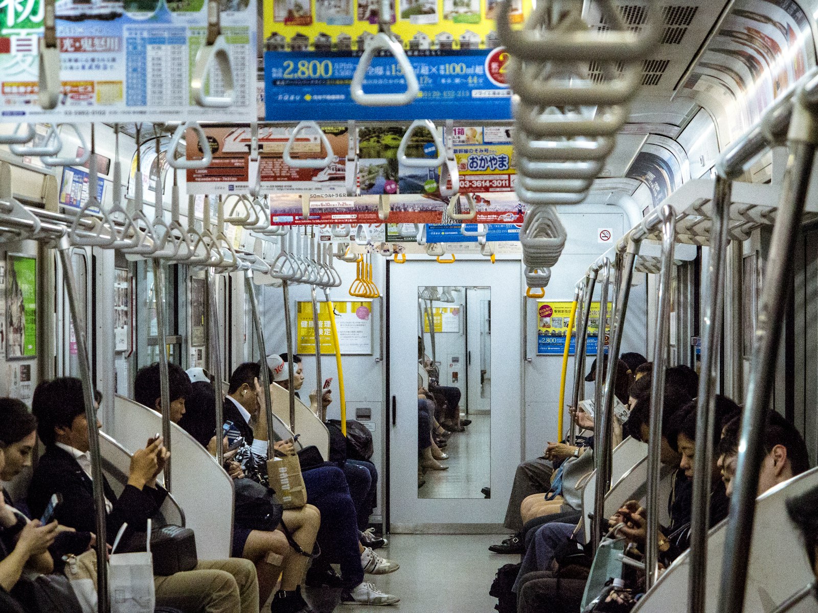 Passengers inside a Tokyo subway car